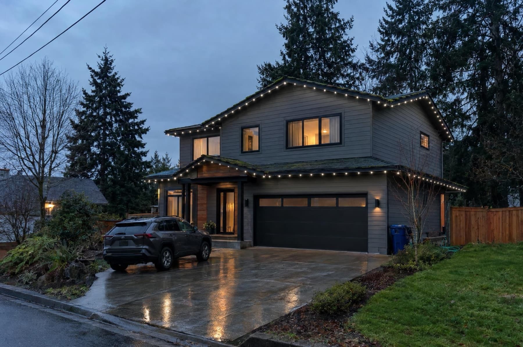 Modern dark-sided home with puck lights in a dark channel glowing neutral white