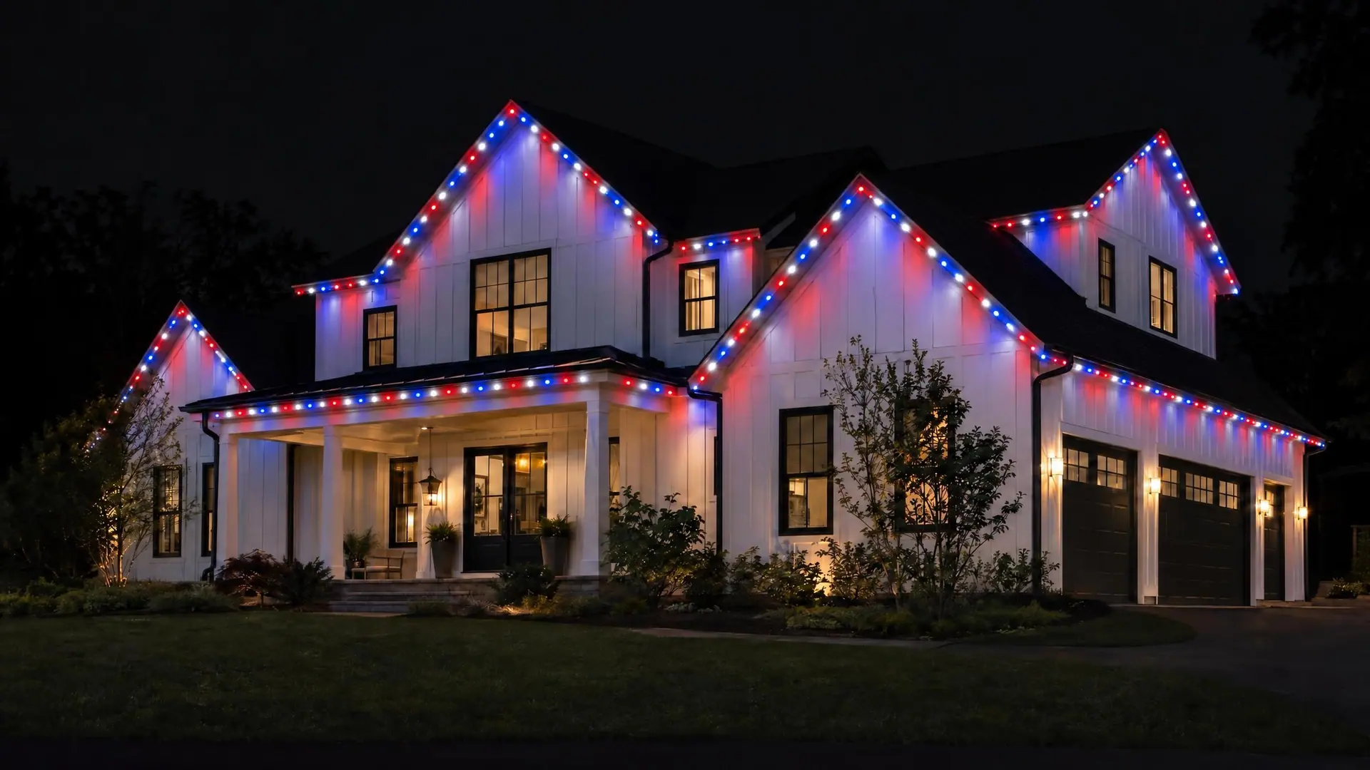 Illustration: the same white farmhouse at night with red, white and blue lights along its gables and eaves