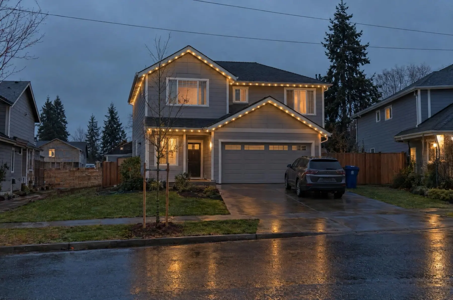 New two-story home in a just-built subdivision with a warm-white lit roofline